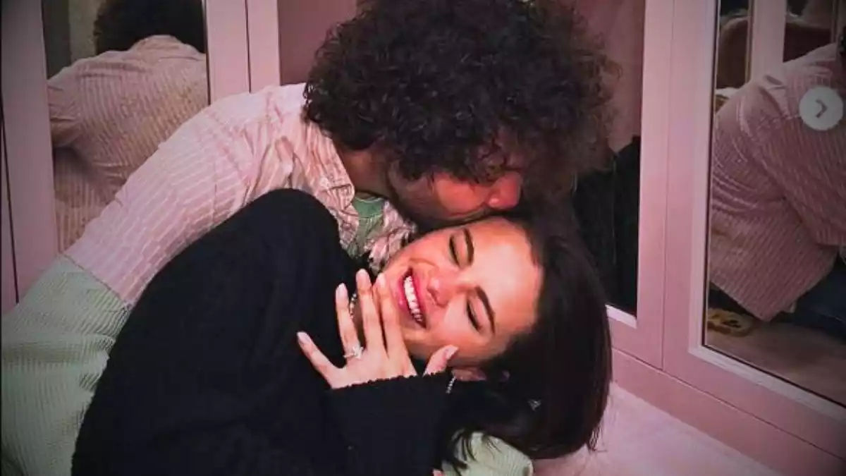 Selena Gomez flaunting her engagement ring with Benny Blanco in a romantic moment.